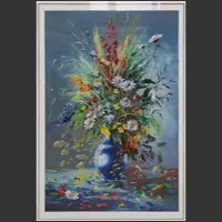 A framed Xiang embroidery depicts an elaborate arrangement of colourful flowers in a blue vase.