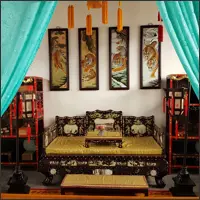 Traditional Chinese room framed by turquoise curtains