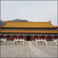 Large Chinese palace building beneath an overcast sky