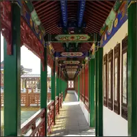 Long covered corridor with colourful painted beams and red pillars