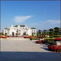 White European-style buildings surrounding a spacious landscaped square