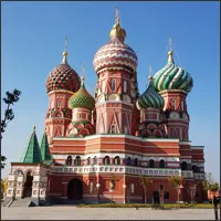 Colourful Russian-style cathedral with onion domes against a blue sky