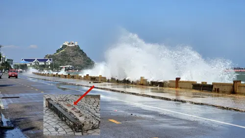 Broken section of seawall after waves hit the Prachuap coastline