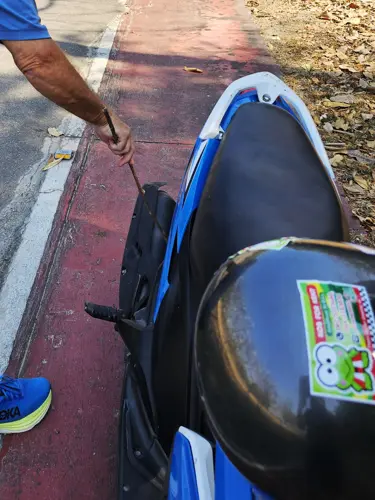 Man trying to clean the mess left by the monkey