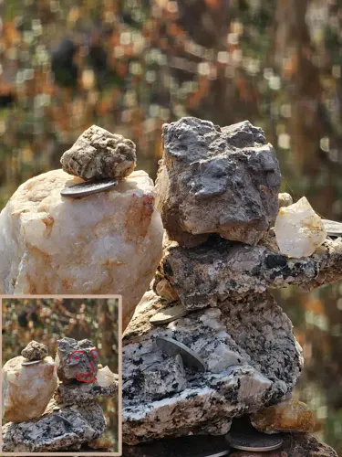 Stacked rocks resembling small faces or figures